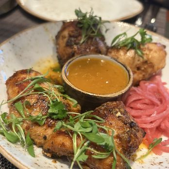 Saffron NOLA signature dishes Crabmeat Pudha, Chicken Lasooni, Pork Vindaloo, Tamarind Shrimp, Lamb Chop Rub